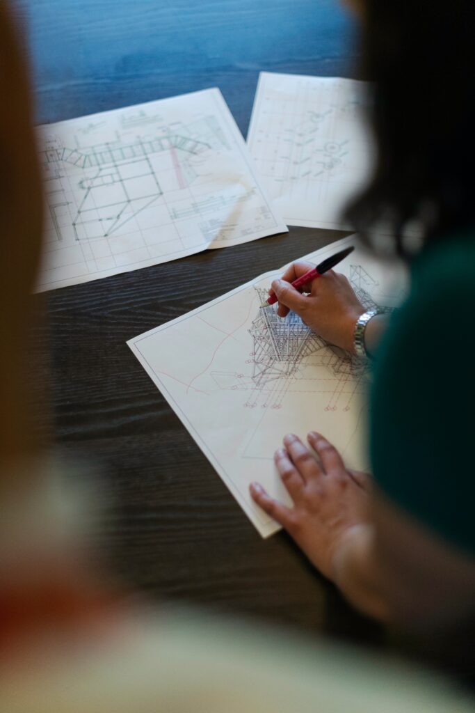 engineer sketching blueprints